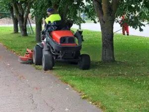 A person considers hiring a lawyer after getting a DUI on a lawn mower.