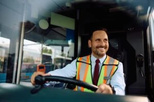 a bus driver smiling. Can you be a bus driver with a DUI?