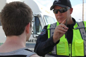 A police officer conducts a field sobriety test after pulling over a driver during saturation patrols.