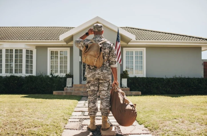 Military member looking at his home