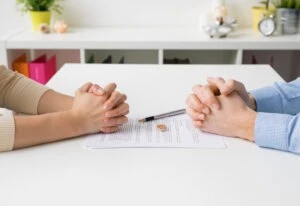 Couple,Going,Through,Divorce,Signing,Papers