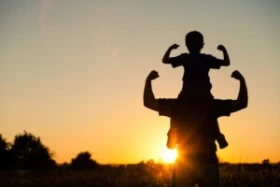 Father,And,Son,Playing,In,The,Park,At,The,Sunset