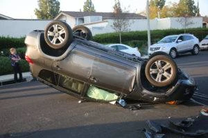 car rolled over in road