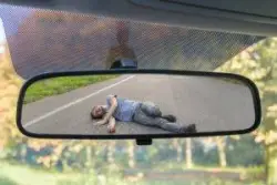 a hit and run victim lying in the road