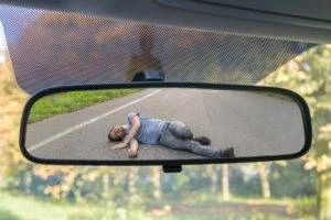 a hit and run victim lying in the road