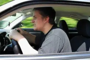 An angry man driving aggressively