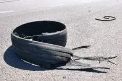 A burst tire on a road.