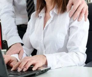 business-man putting his hand on a woman’s shoulder