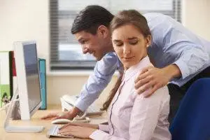 man sexually harasses female colleague