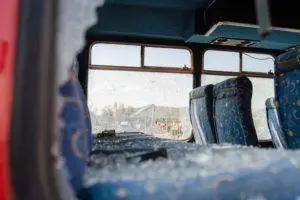bus interior with broken windows after crash