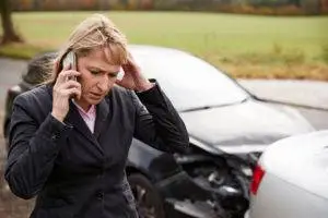 motorist on phone after auto collision