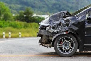 black car with severely damaged front end