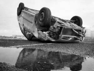 overturned car on roadway