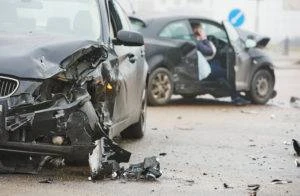 two heavily damaged vehicles after collision