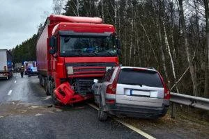 a large truck and a passenger vehicle after a collision