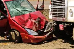 a passenger vehicle involved in a collision with a large truck