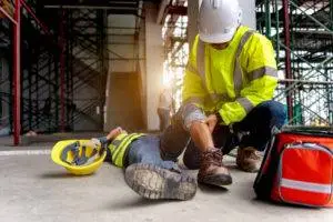 an injured construction worker being attended to after an accident