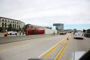 an overturned semi truck on the freeway