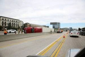 an overturned semi truck on the freeway