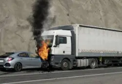 car and truck on fire after an accident