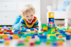 happy child playing with blocks