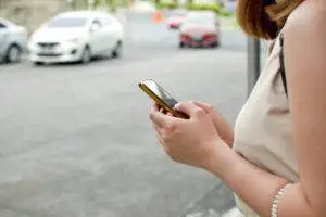 A woman contacts a legal representative after an Uber accident.