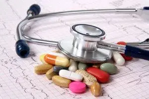 colorful medication under stethoscope