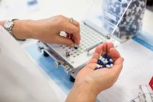 factory worker testing pills