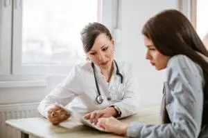 patient consults with doctor