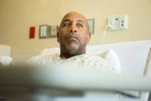 man in hospital bed