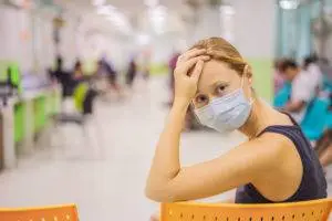 worried woman in hospital waiting room