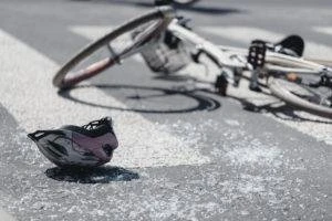 bicycle and helmet in middle of crosswalk