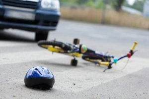 helmet-bicycle-and-car-in-crosswalk