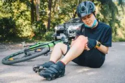 woman sustains knee injury after bicycle accident