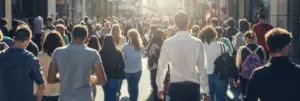 pedestrians walk in large crowd