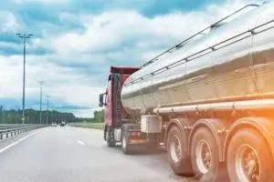 truck hauls fuel down interstate
