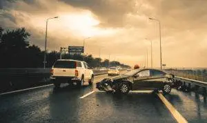 car accident on busy rainy highway