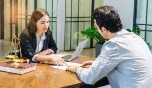 attorney-discusses-paperwork-with-her-client