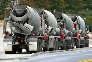 Concrete trucks driving down the street. Contact a Passaic concrete truck accident lawyer if you’ve been hit by one.