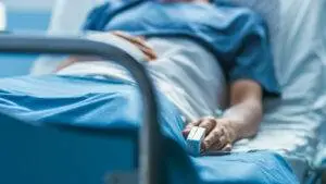 A patient with a catastrophic injury is recovering in a hospital bed. A catastrophic injury attorney in Edwardsville can help you seek justice.