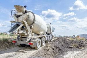 A concrete mixer truck on a job site. Call Morelli Law if you’re hit by one at work or on the job site.