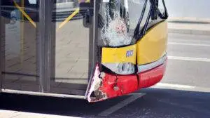 The front-end of a bus smashed up from an accident.