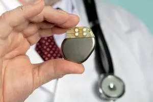 a-doctor-holding-a-pacemaker
