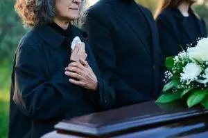 woman at a funeral for a wrongful death in Brooklyn 