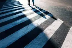 Pedestrians in the evening. Discuss your legal claim with a Carbondale pedestrian accident lawyer.