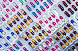Rows of packaged, colorful pills. 