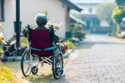 old woman coping with spinal cord injury