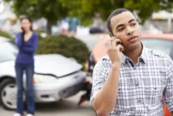 A man calling a Palmdale car accident lawyer after a collision.