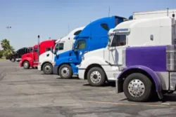 A group of commercial vehicles. You can contact a Palmdale truck accident lawyer after a collision with any large vehicle.
