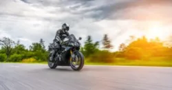 A motorcyclist speeds down a local road. A Bakersfield motorcycle accident lawyer can help you after a wreck.